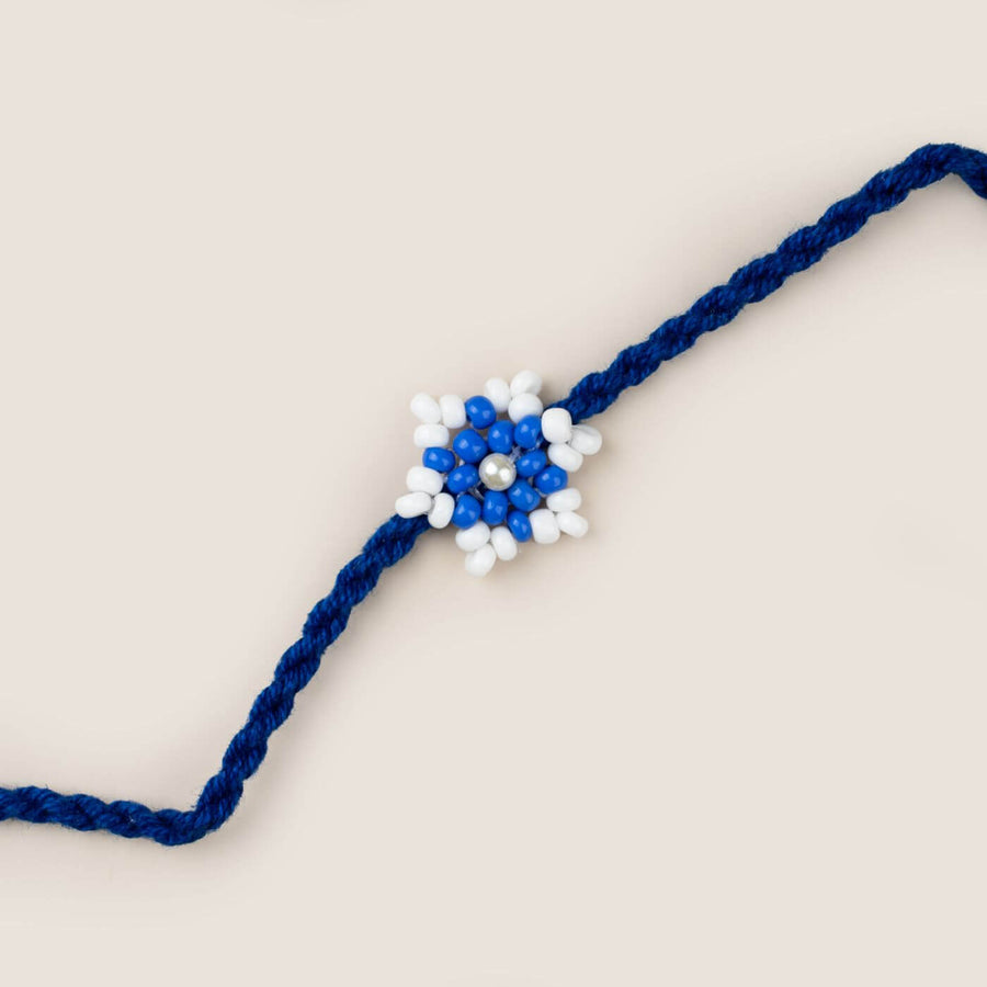 Handcrafted Glass Beads Tara Rakhi 2 - Close-up of Blue Beaded Rakhi