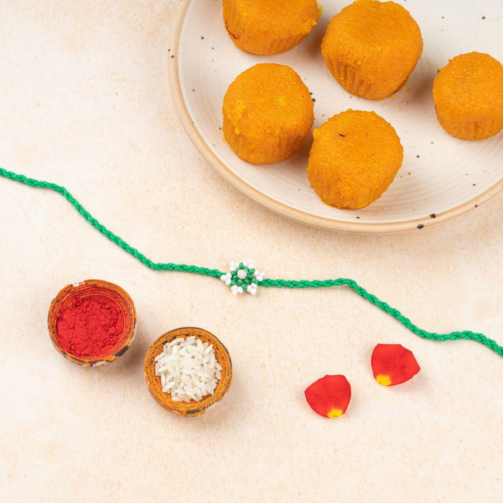 Handcrafted Glass Beads Tara Rakhi 5 - Styled with Traditional Festive Items