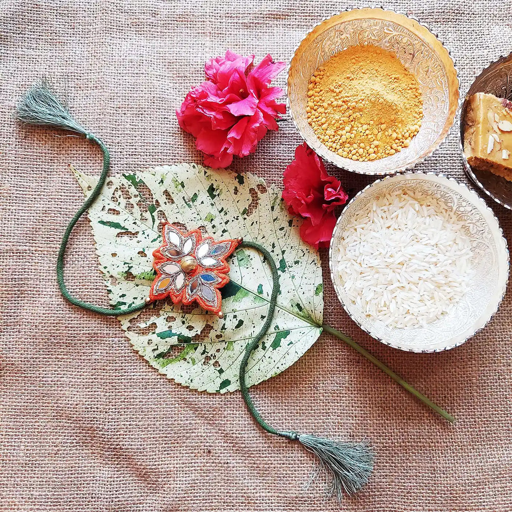 Handmade Dori Work Festive Flower Rakhi With Roli Chawal - Styled with Festive Items