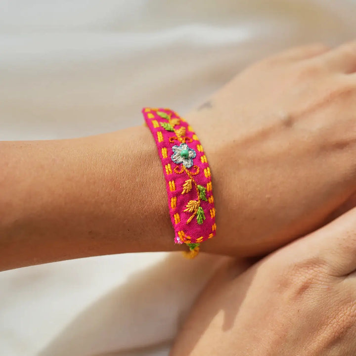 Handmade Embroidered And Beaded Pom Pom Toli And Laddoo Rakhi With Roli Chawal Set Of 2 - Close-up of Embroidered Bracelet