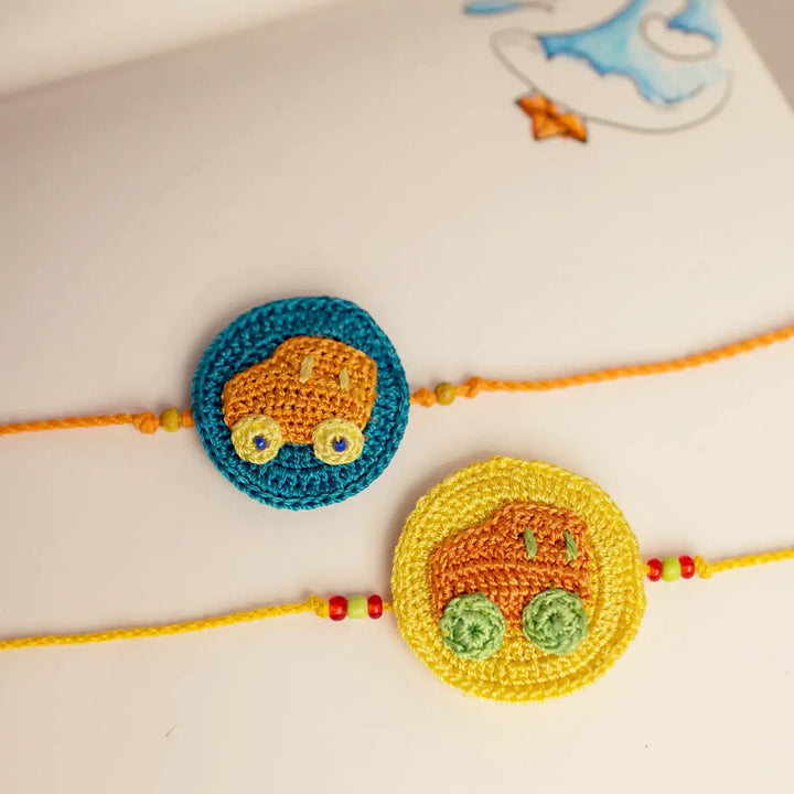 Handmade Crochet Playful Cars Theme Kids Rakhi With Roli Chawal Set Of 2 - Close-up of crochet car charms