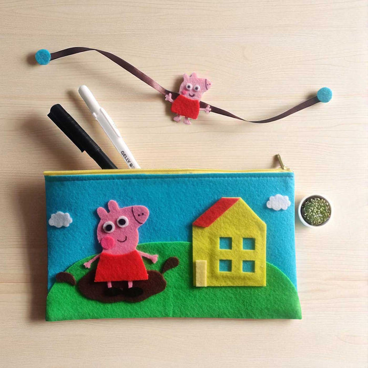 Handmade Peppa Pig Theme Felt Rakhi Hamper Includes 1 Rakhi And 1 Pouch - Front View with Pen and Rakhi
