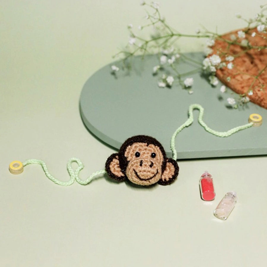 Handmade Crochet Playful Monkey Kids Rakhi With Roli Chawal - Front View