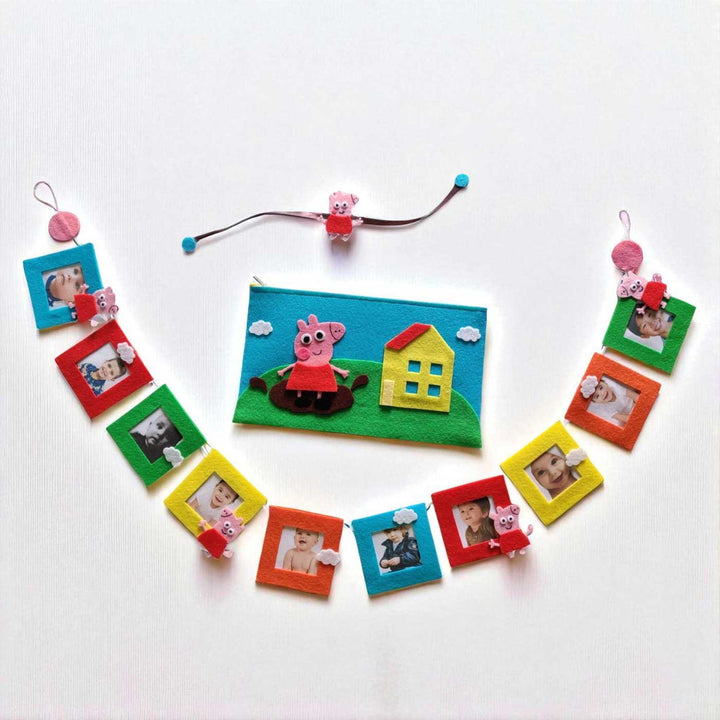 Handmade Peppa Pig Theme Felt Rakhi And Gift Combo Includes 1 Rakhi 1 Photo Bunting And 1 Pouch - Flat Lay Arrangement