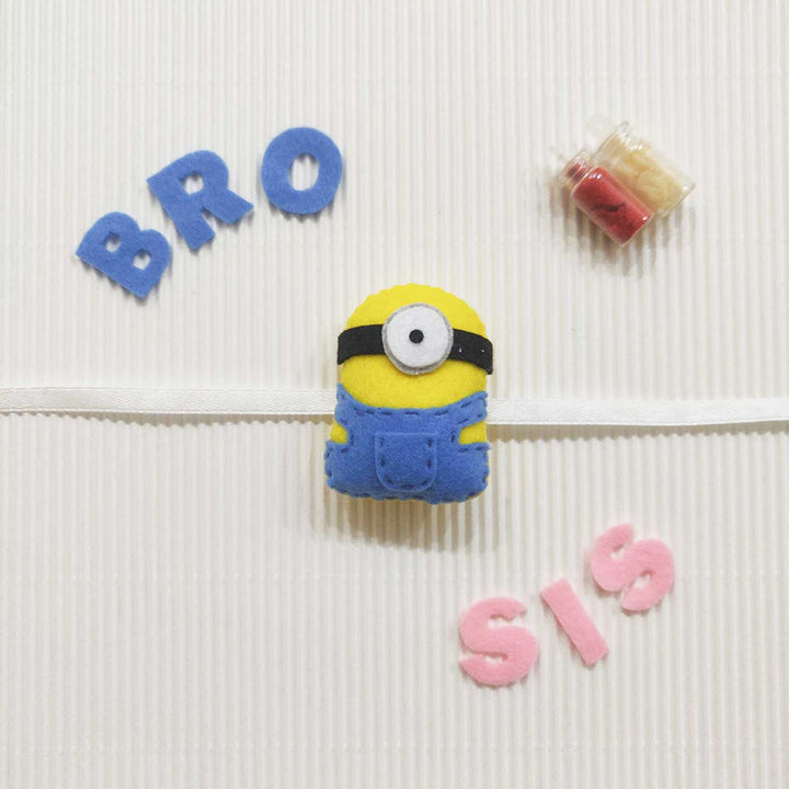 Handmade Minion Theme Felt Kids Rakhi With Roli Chawal 10 - Front View with Letters and Accessories