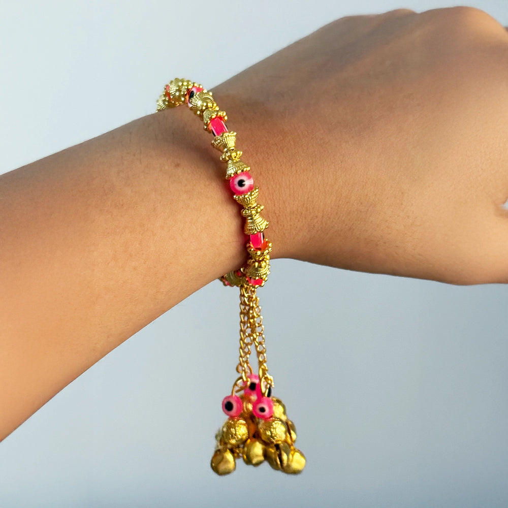 Handmade Golden Evil Eye And Ghungroo Bangle Lumba Rakhi For Bhabhi With Roli Chawal - Worn on Wrist Display