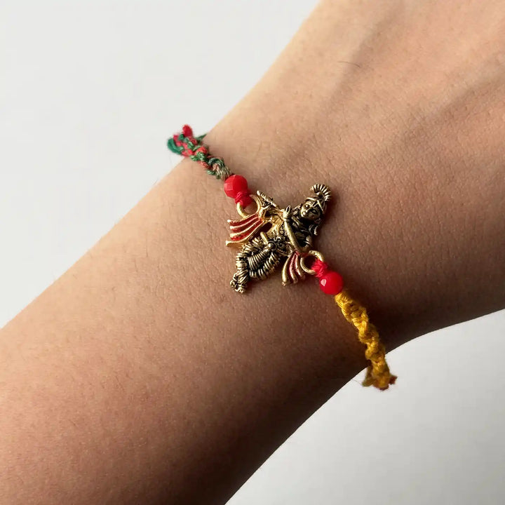 Handmade Krishna Motif Rakhi With Roli Chawal - Bracelet worn on wrist