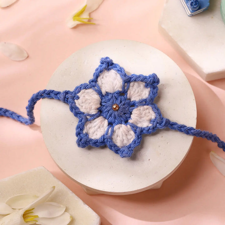 Handmade Crochet White & Blue Flower Rakhi With Roli Chawal