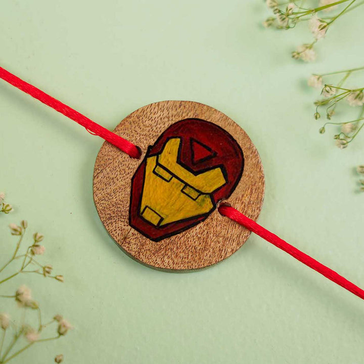 Personalized Hand Painted Iron Man Theme Wooden Rakhi With Roli Chawal - Flat Lay Close-up View