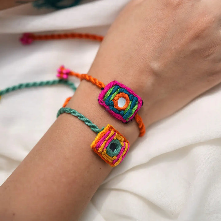 Handmade Embroidered And Beaded Mini Laddoo And Aaina Rakhi With Roli Chawal Set Of 5 - Close-up of bracelet details