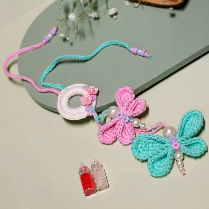 Handmade Crochet Budding Butterflies Kids Lumba Rakhi For Girls With Roli Chawal - Side angle showing butterfly details