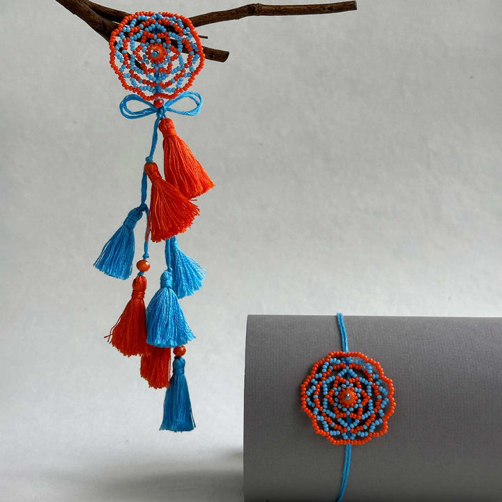 Customized Handmade Beaded Mandala Design Lumba Rakhi For Bhabhi With Roli Chawal - Hanging View with Tassels