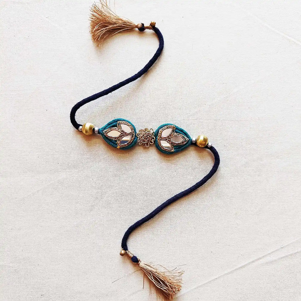 Handmade Mirror Work And Ghungroo Teal Bhaiya Bhabhi Rakhi With Roli Chawal Set Of 2 - Single Bracelet Close-up