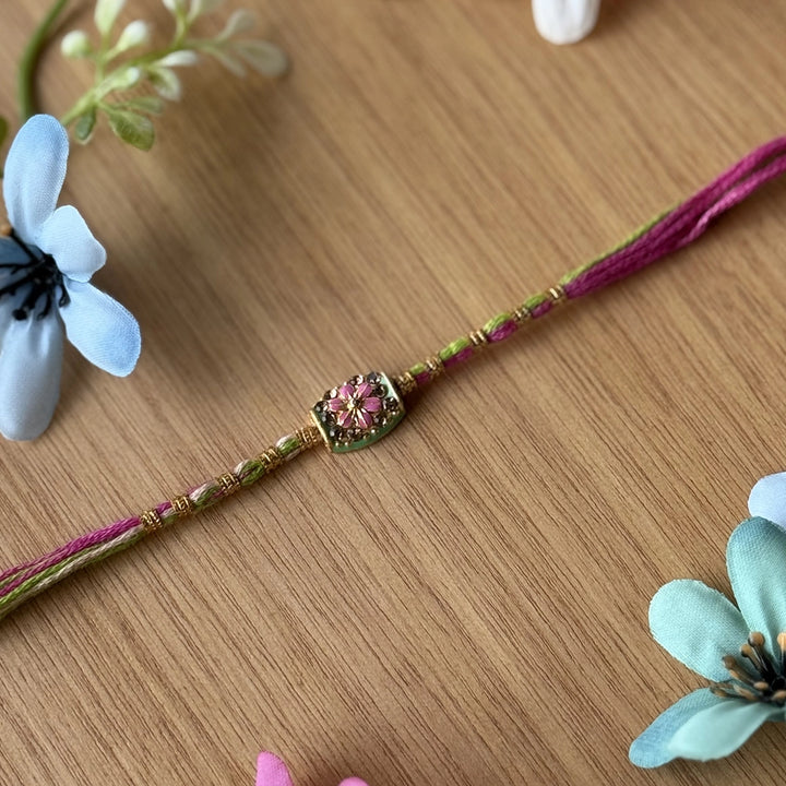 Handmade Stone Embedded Flower Rakhi With Roli Chawal - Single Bracelet Close-up Pink Variant