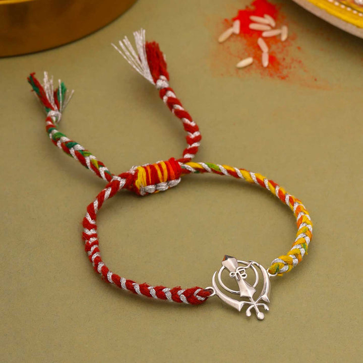 Handmade Sikh Design Religious Silver Rakhi For Brother - Flat Lay with Full Bracelet
