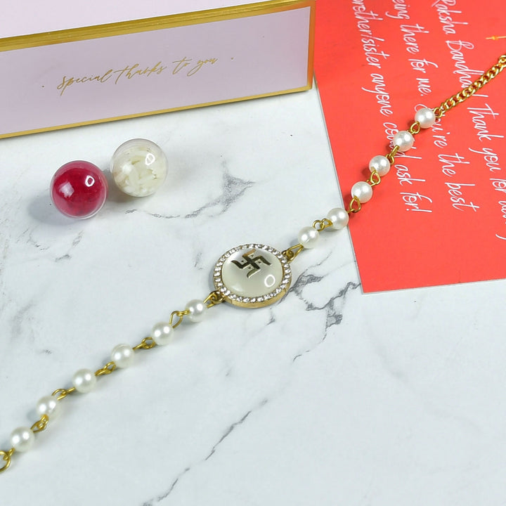 Beaded Swastik Bracelet Rakhi Hamper With Chocolates And Roli Chawal For Brother Customizable Options Includes Up To 7 Goodies - Rakhi bracelet with beads close-up