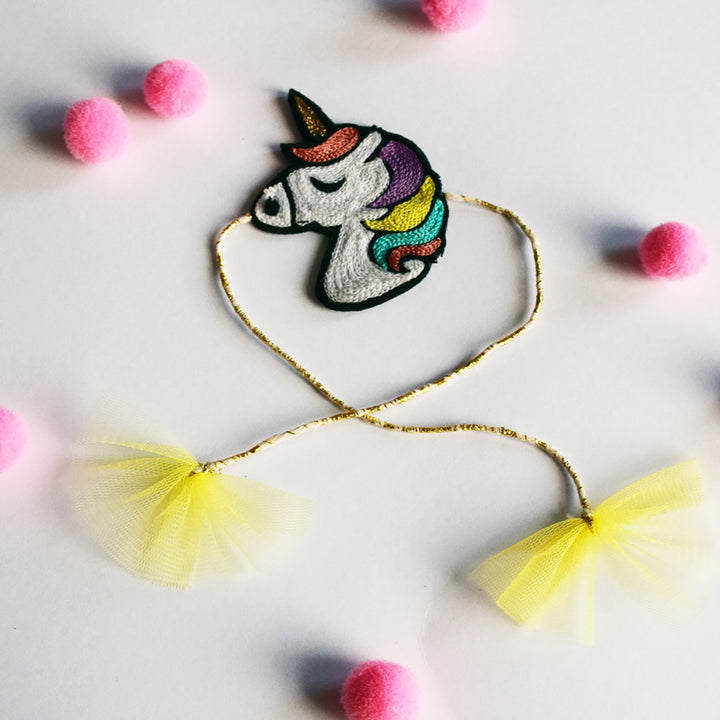 Handmade Unicorn Felt Kids Rakhi - Flat Lay with Accessories