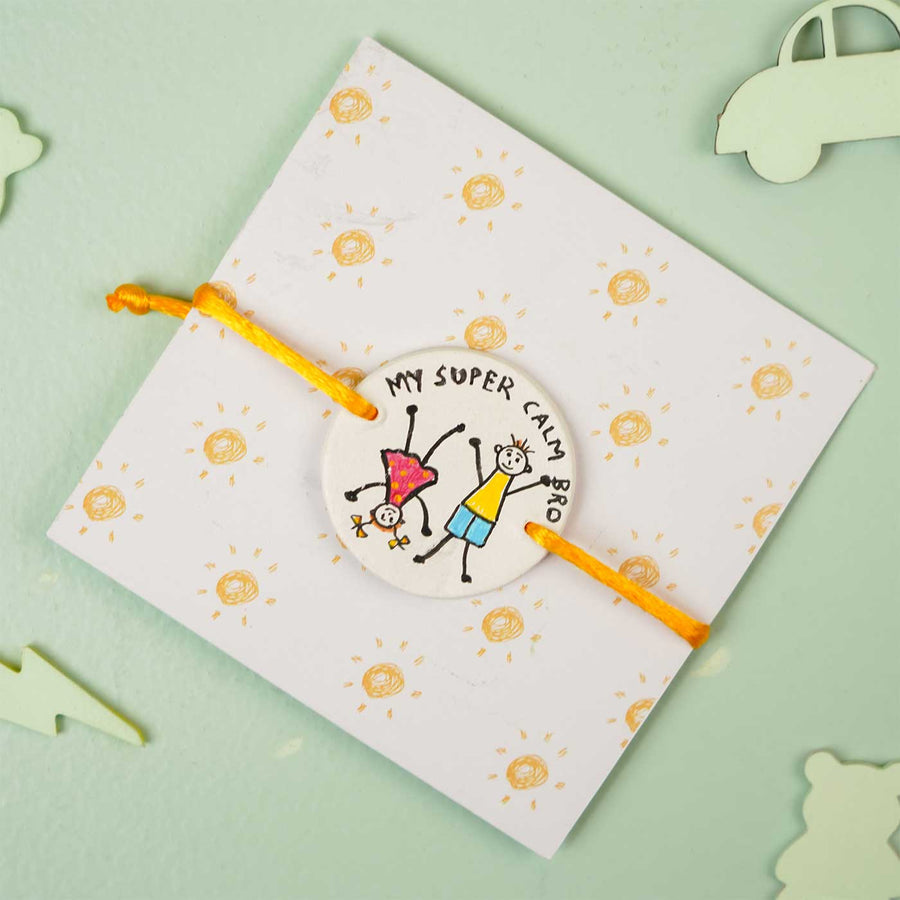 Personalized Hand Painted Super Calm Bro Clay Rakhi With Roli Chawal - On Card Packaging Display
