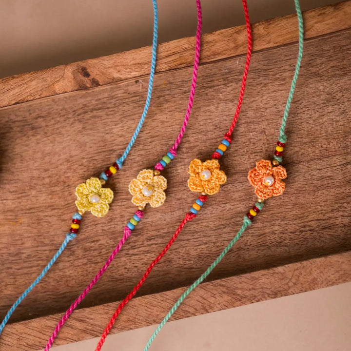 Handmade Crochet Pink Daisies Rakhi With Roli Chawal Set Of 4 - Close-up of flower detail line-up