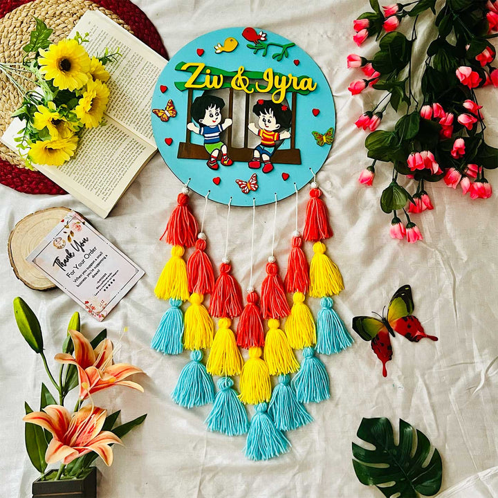 Personalized Hand Painted Sibling Swinging In A Garden Mdf Wood Kids Name Plate - Flat Lay Display with Surroundings