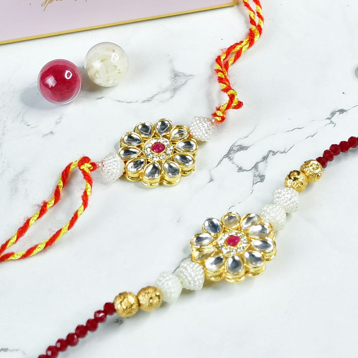 Beaded Floral Pearl And Stone Rakhi Hamper With Chocolates And Roli Chawal For Bhaiya And Bhabhi Customizable Options Includes Up To 7 Goodies - Rakhis with rice and beads