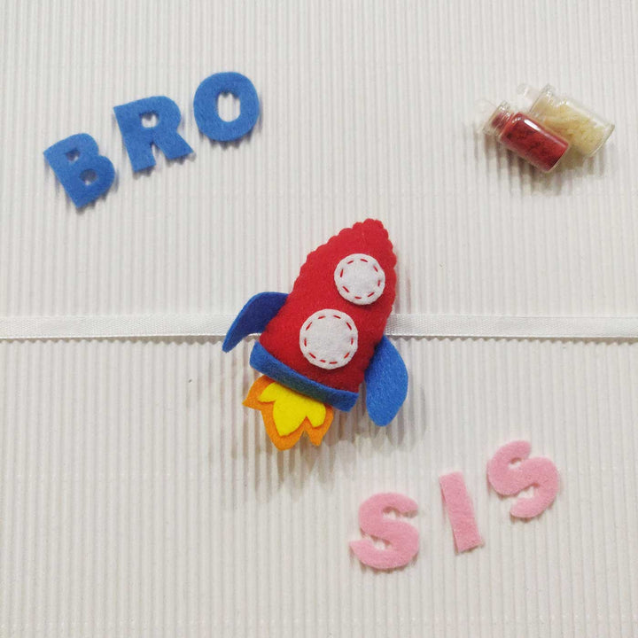 Handmade Rocket Theme Felt Kids Rakhi With Roli Chawal - Rocket Toy with BRO SIS Letters