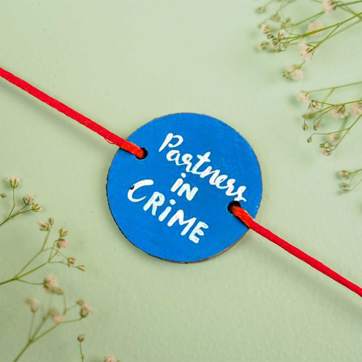 Personalized Hand Painted Partner In Crime Wooden Rakhi With Roli Chawal - Close-up View of Bracelet