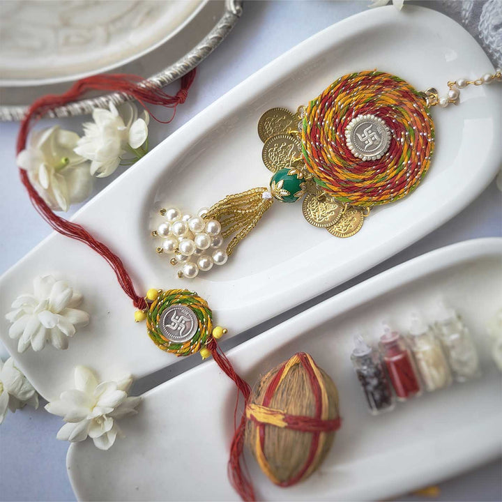 Handmade Beaded Swatik Design Silver Rakhi Hamper With Roli Chawal For Bhaiya And Bhabhi - Decorative Rakhi Set Display