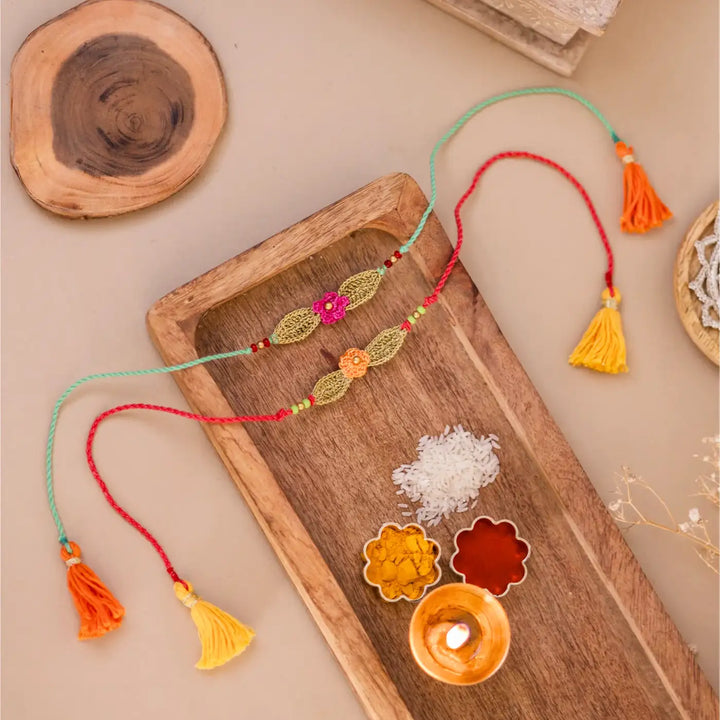 Handmade Crochet Bageeya Rakhi With Roli Chawal Set Of 2 - Styled Display with Ritual Props