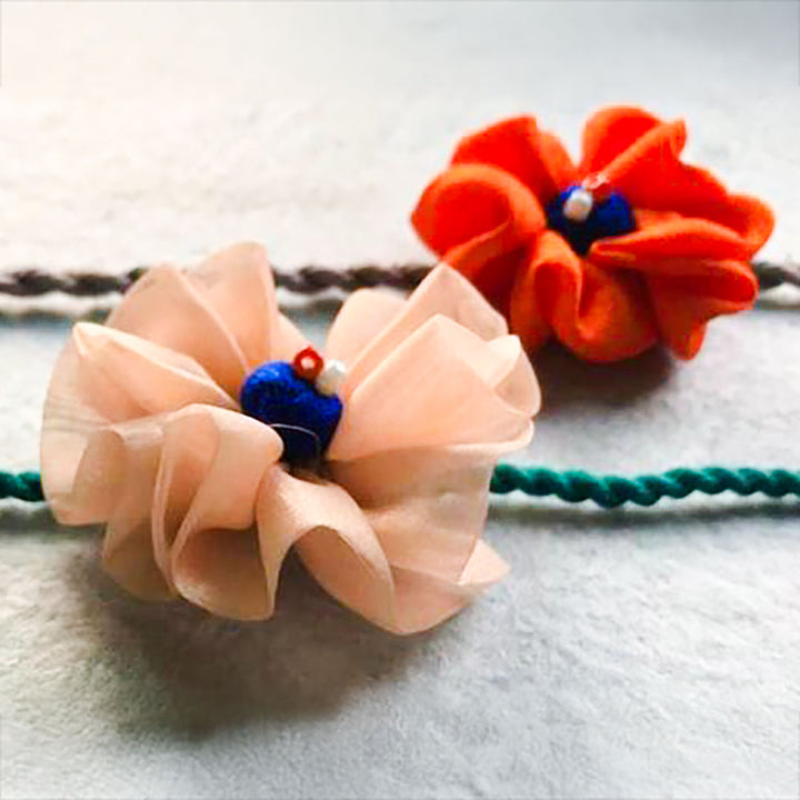 Handmade Flower Bloom Design Upcycled Fabric Rakhi With Roli Chawal For Brother - Close-up of Fabric Flowers