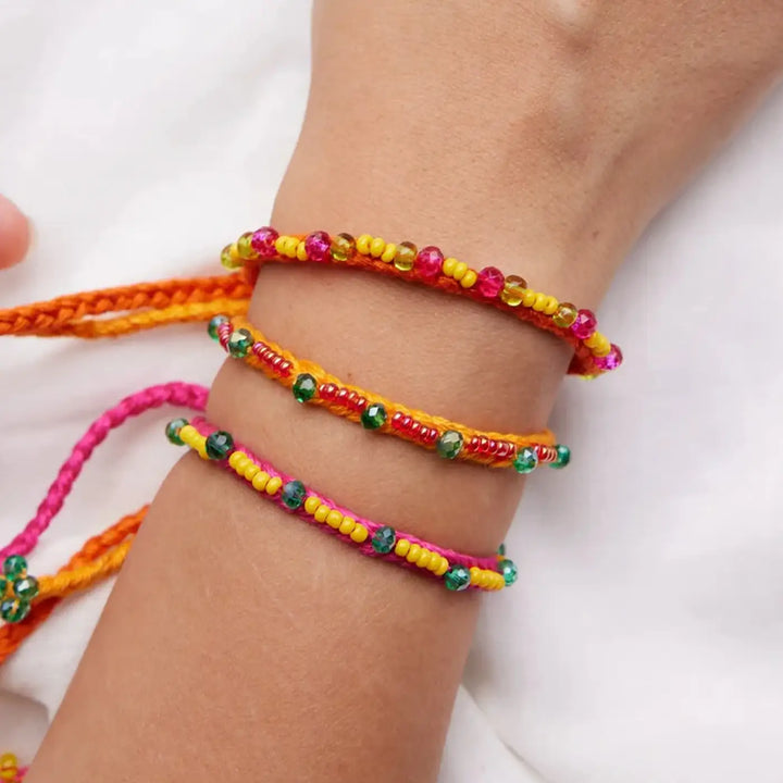 Handmade Beaded Minimalist Manku Rakhi With Roli Chawal Set Of 3 - Close-up on Wrist Wearing Bracelets