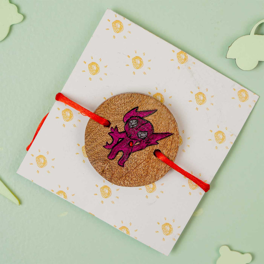 Personalized Hand Painted Sableye Wooden Rakhi With Roli Chawal - Front View on Gift Card