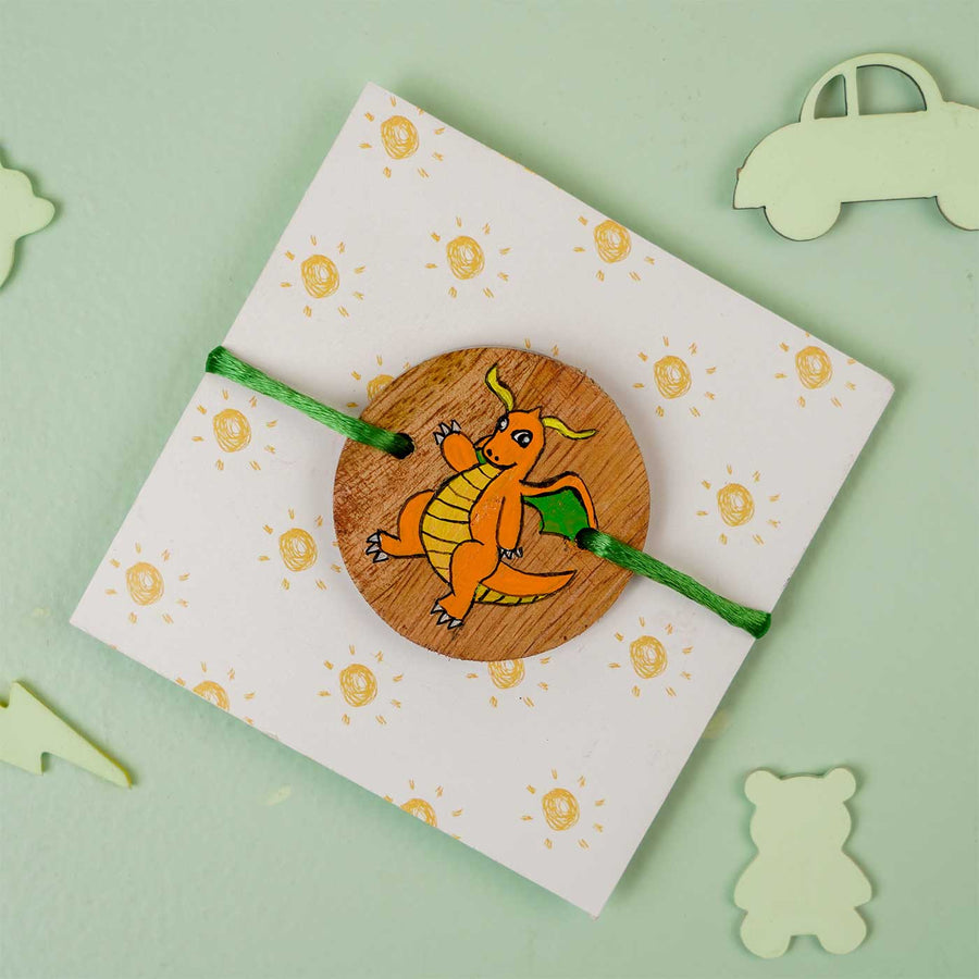 Personalized Hand Painted Dragonite Wooden Rakhi With Roli Chawal - Wrapped on Cardstock Display