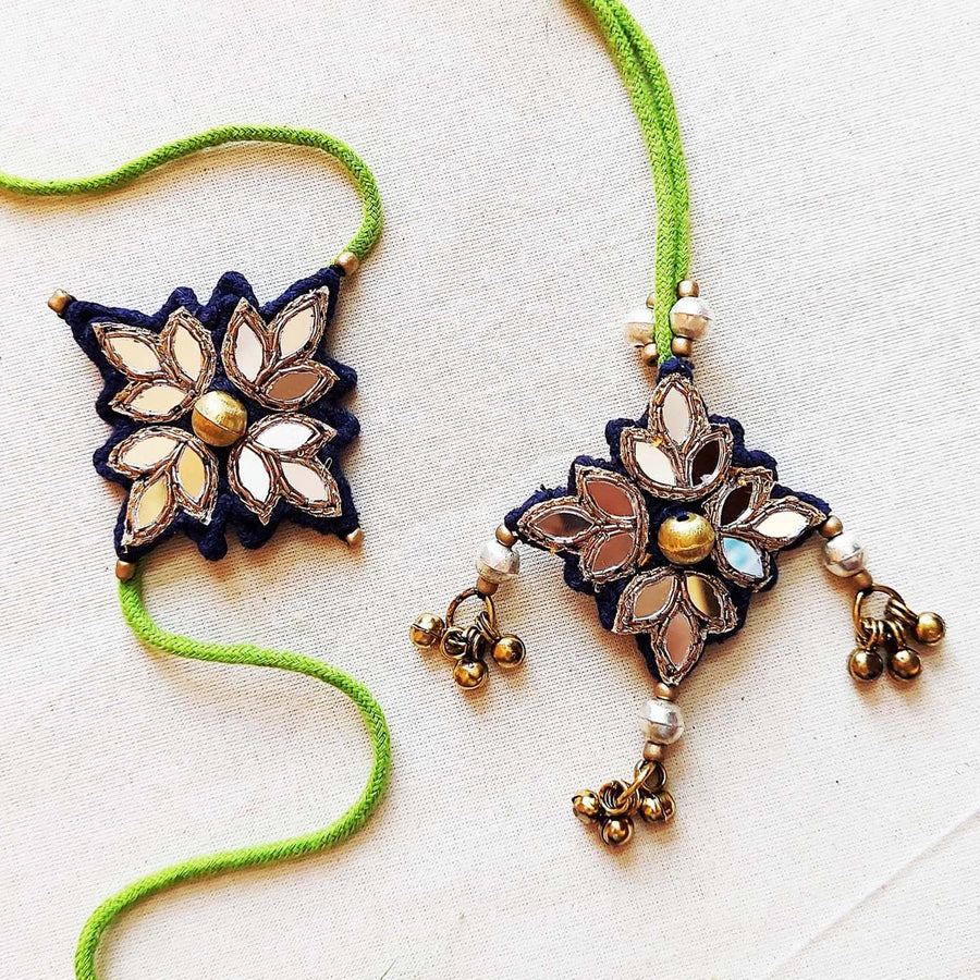Handmade Mirror Work And Ghungroo Blue Bhaiya Bhabhi Rakhi With Roli Chawal Set Of 2 - Two Product Pieces Laid Flat
