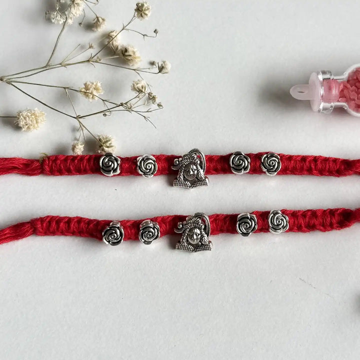 Handmade Shiv Motif Rakhi With Roli Chawal - Flat Lay with Two Bracelets