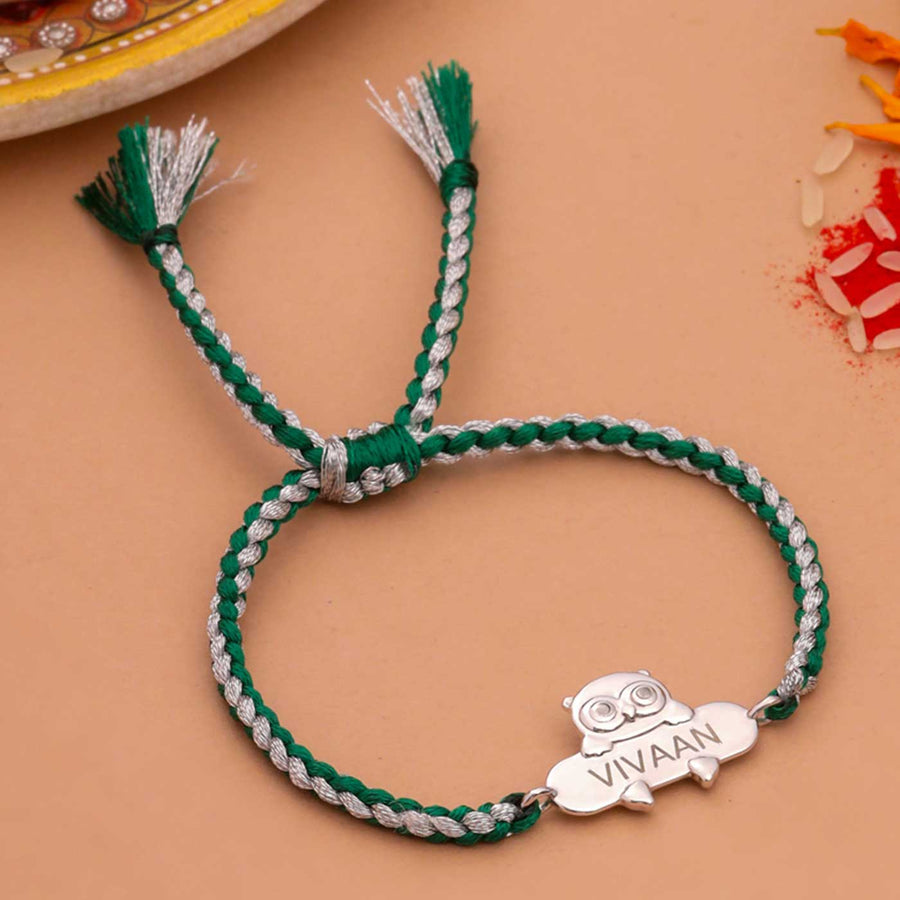 Personalized Handmade Owl Design Silver Kids Rakhi - Flat Lay Front View