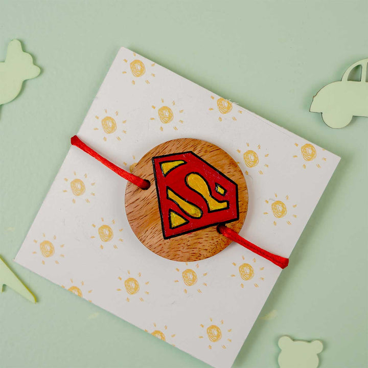 Personalized Hand Painted Super Man Wooden Rakhi With Roli Chawal - Card Mounted View