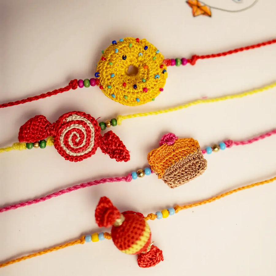 Handmade Crochet Candy Theme Rakhi With Roli Chawal Set Of 4 - Close-up of Crochet Bracelets