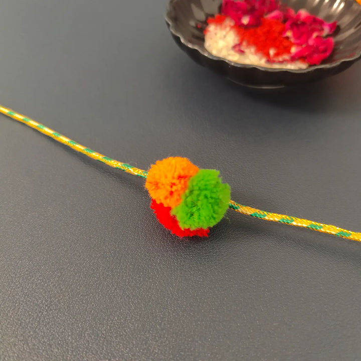 Handmade Multicolour Pom Pom Rakhi With Roli Chawal
