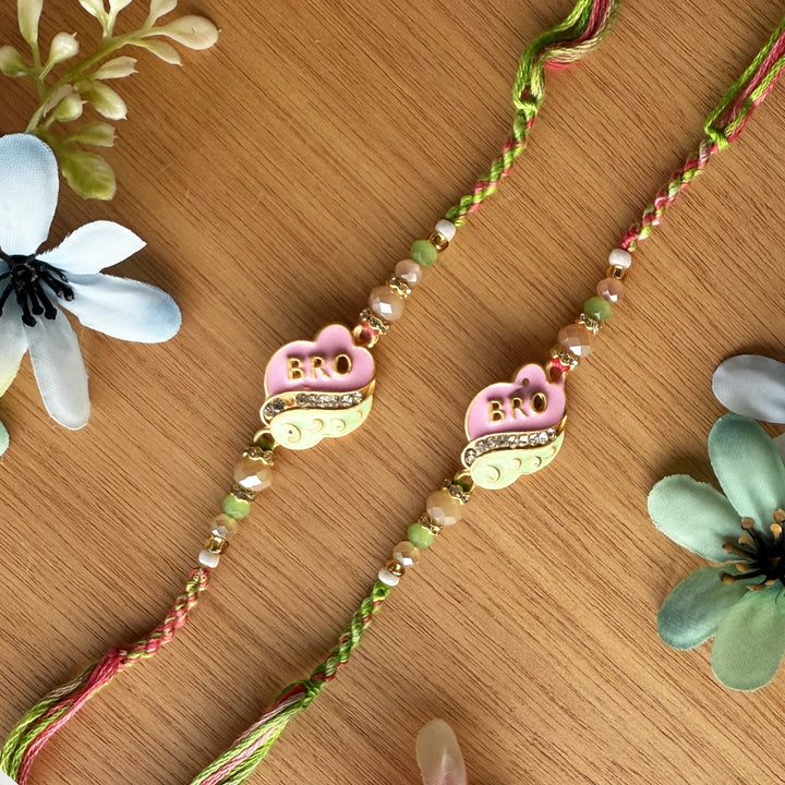 Handmade Pink And Green Beaded Bro Rakhi With Roli Chawal - Detailed Front View with Flowers