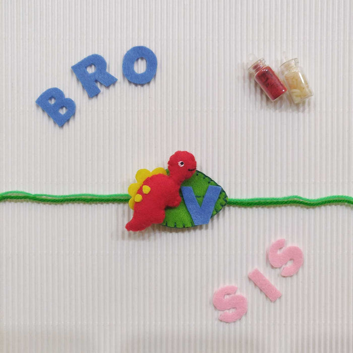 Personalized Handmade Dinosaur Theme Felt Kids Rakhi With Roli Chawal - Red dinosaur wristband with letters