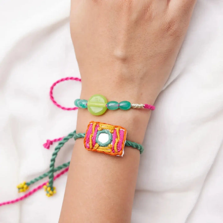Handmade Beaded And Mirror Work Litchi Rakhi With Roli Chawal Set Of 2 - Wrist Wearing Two Bracelets