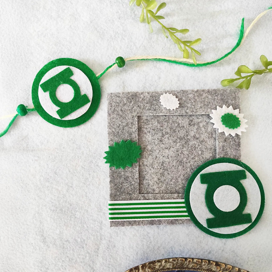 Photo Personalized Green Lantern Felt Rakhi Hamper With Roli Chawal Includes 1 Magnetic Photo Frame 1 Rakhi - Flat Lay Display