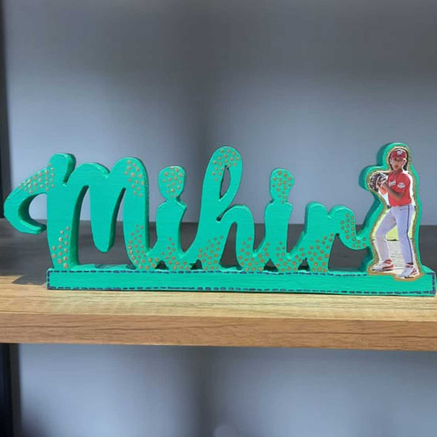 Personalized Handmade Kalakaar Wooden Cutout Name Plate For Boys - Front View on Shelf Display