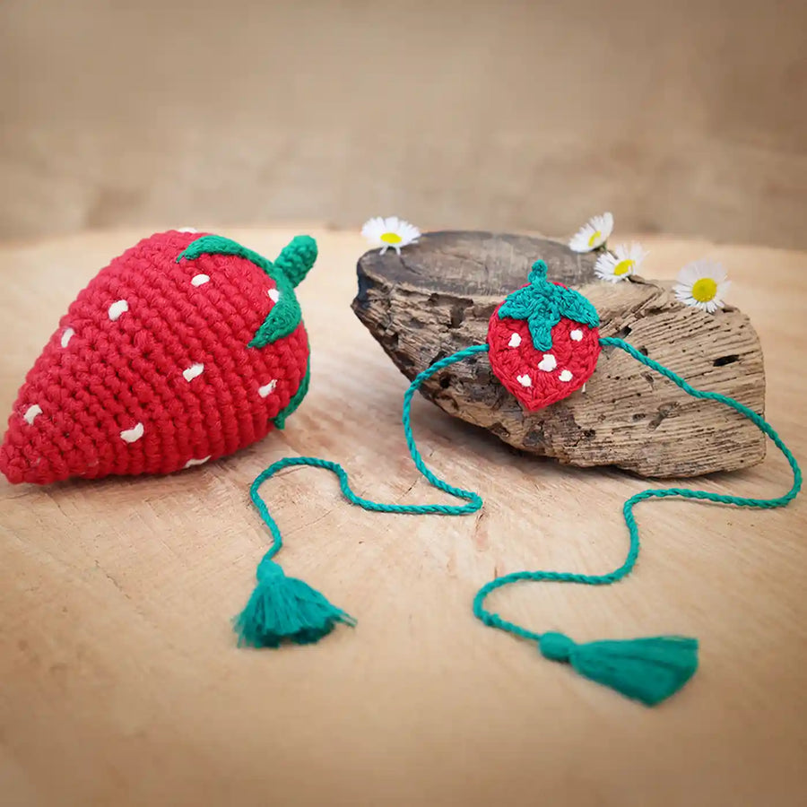 Handmade Crochet Strawberry Theme Kids Rakhi And Toy Combo With Roli Chawal Set Of 2 - Product and Strap Display