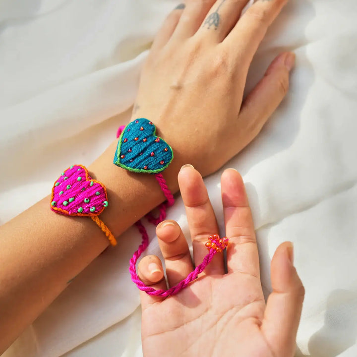 Handmade Embroidered Heart Shaped Only Love Rakhi With Roli Chawal Set Of 2 - Heart Bracelets on Wrist and Hand