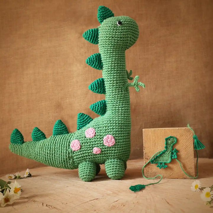 Handmade Crochet Dino Theme Kids Rakhi And Toy Combo With Roli Chawal Set Of 2 - Front View of Crochet Dinosaur Toy