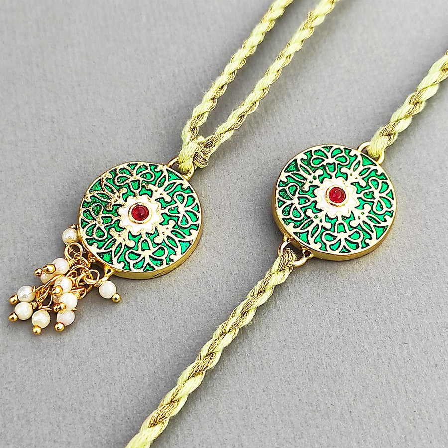 Handmade Meenakari Green Buta Brass Bhaiya Bhabhi Rakhi With Roli Chawal - Close-up Showing Design Detail