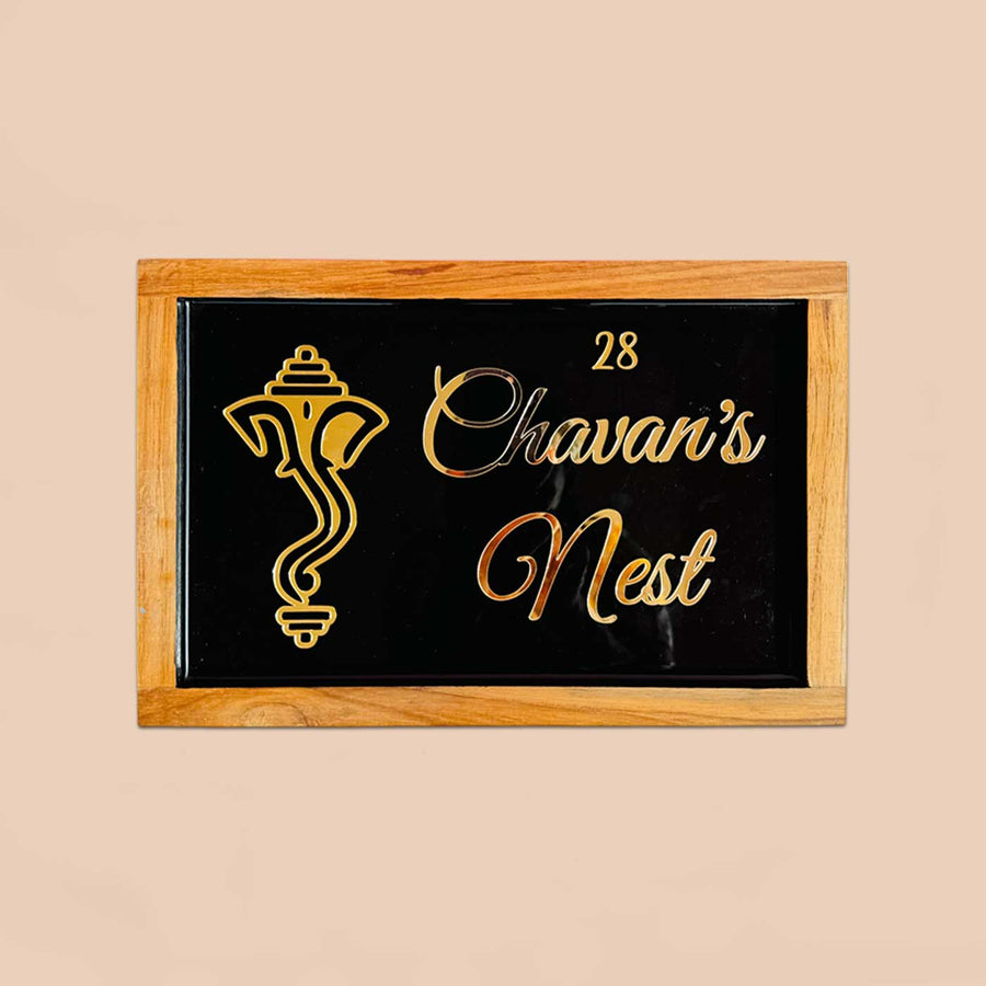 Personalized Ganesha Face Theme Resin Name Plate With Teak Wood Border For Couples - Front View on Neutral Background