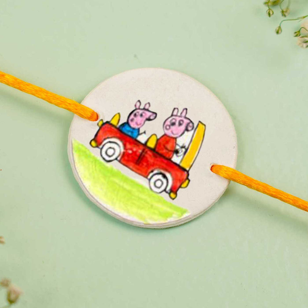 Personalized Hand Painted Peppa Pig Theme Clay Rakhi With Roli Chawal - Close-up of Painted Design
